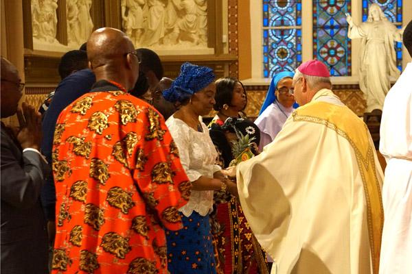 The Nigerian Catholic community presents the gifts, including fruits and other food during the MLK Memorial Mass. (Malea Hargett photo) 
