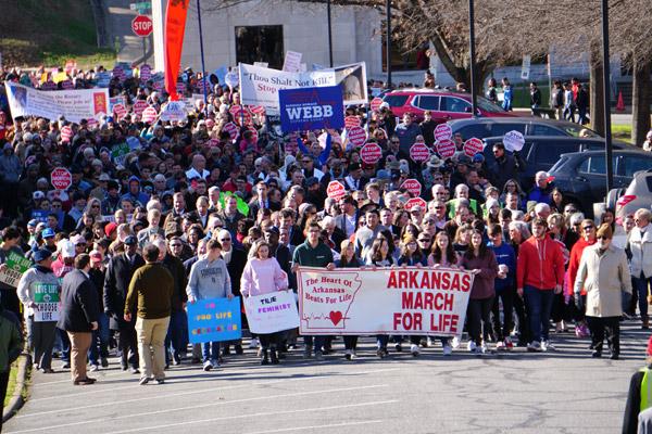 Hundreds of people march on the State Capitol grounds Jan. 19 during the 42nd annual March for Life, sponsored by Arkansas Right to Life. The march is held to remember the anniversary of the Roe v. Wade decision. (Malea Hargett photo)