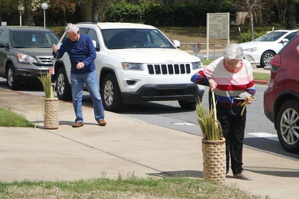 In Little Rock, Christ the King parishioners pick up palms after the livestreamed Palm Sunday Mass April 5. (Malea Hargett photo)