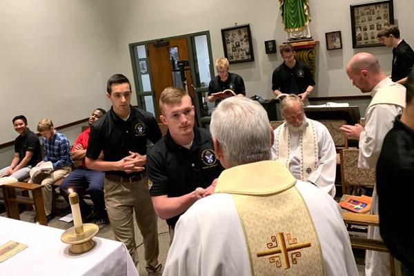 Bishop Anthony B. Taylor distributes Communion to seminarian Joseph Jones at the diocesan House of Formation in Little Rock on Holy Thursday, April 9. (Pablo Quintana photo) (Not available for sale)
