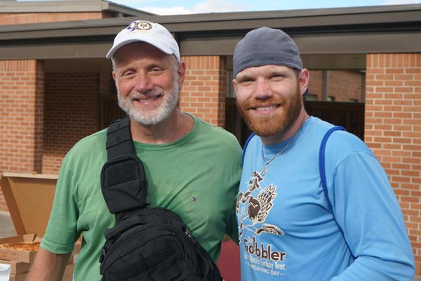 Msgr. Scott Friend (left) and Deacon Joseph Friend began walking together at least five miles a day when Joseph Friend returned to Arkansas March 13 from his seminary in Indiana. (Malea Hargett photo)