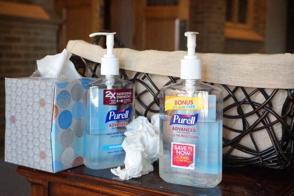 Parishioners at St. Joseph Church in Conway are instructed to use hand sanitizer upon entering and can drop off their offering in the collection basket. It’s one of several restrictions parishes have implemented since public Masses resumed in early May. (Aprille Hanson photo)