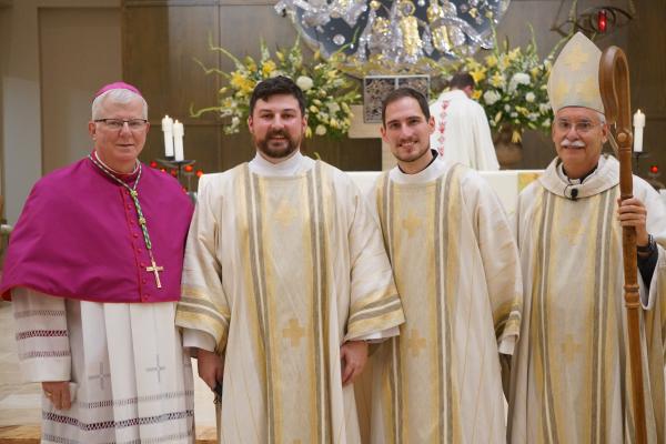 Bishop Francis I. Malone (left) of Shreveport returned to Christ the King Church in Little Rock Aug. 14 to celebrate with Bishop Anthony B. Taylor the diaconate ordination of Brian Cundall (second from left) and Ben Riley. Bishop Malone was formerly pastor at Christ the King. (Malea Hargett photo)