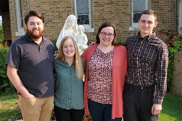 RCIA mentors Kevin and Courtney Herrington (left) pose with candidates Jennifer and Alex Moffitt after Mass Oct. 3 at St. Joseph Church in Conway. The couples have been meeting as part of the one-on-one RCIA mentor approach. (Andrea Ziminsky photo) 
