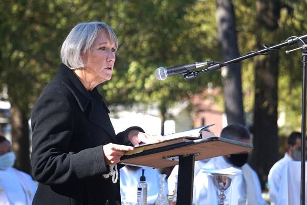 Liz Tingquist, diocesan director of youth and campus ministry, serves as the lector for the All Souls’ Day Mass at Calvary Cemetery in Little Rock Nov. 2. (Aprille Hanson photo) 