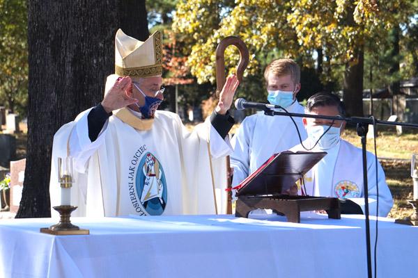 Bishop Taylor blesses the faithful at the conclusion of the All Souls’ Day Mass at Calvary Cemetery Nov. 2. (Aprille Hanson photo) 