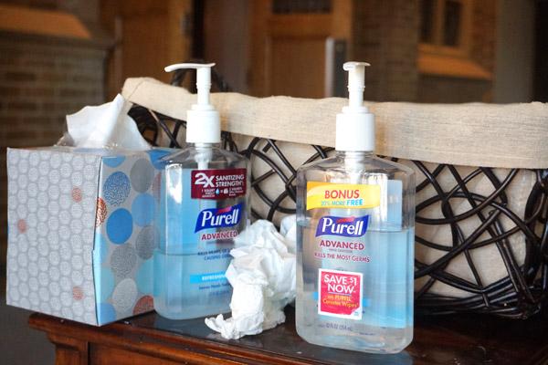 Parishioners at St. Joseph Church in Conway are required to use hand sanitizer upon entering the church for Mass June 6 and can drop off their offering in the collection basket. It’s one of several restrictions parishes implemented when public Masses resumed in early May. (Aprille Hanson photo, Arkansas Catholic file)