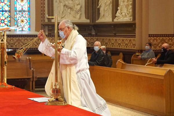 Deacon B.J. Bowen incenses the altar during the Benediction before the Mass for Life. (Malea Hargett photo)