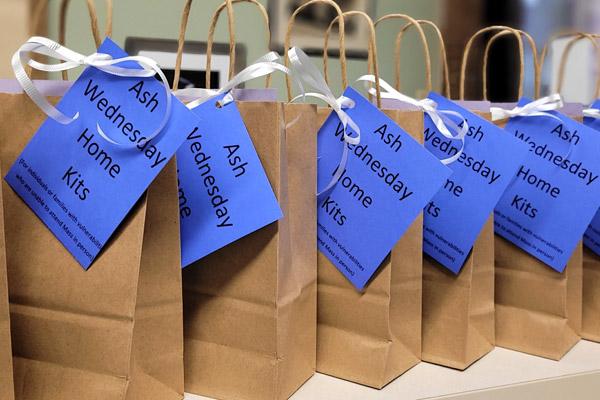 Ash Wednesday home kits are lined up at Our Lady of the Holy Souls Church in Little Rock Feb. 9. Staff members helped pack about 30 kits for people watching the Mass from home due to COVID-19, before the winter storm affected traveling to Mass. (Stacey Matchett photo)