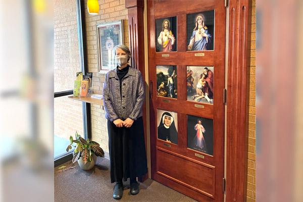 Laura Woford stands by the door of mercy at her parish, Our Lady of Good Counsel Church in Little Rock, Feb. 21. She has had a devotion to the Divine Mercy Chaplet for more than 20 years. (Courtesy Laura Woford)