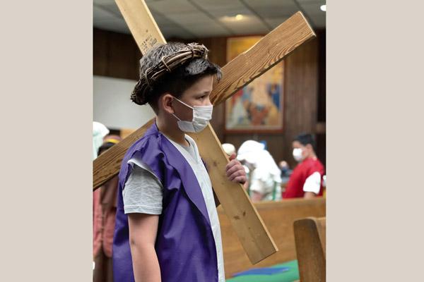 Logan Ross, a fourth grader at Christ the King School in Fort Smith, portrays Jesus during Mary’s Way of the Cross on Good Friday, April 2. The fourth grade brings Mary’s Way of the Cross to life for the parish every year. Theresa Piechocki and Corinne Vela are their teachers. (Courtesy Myndi Keyton; Photo prints not available.)