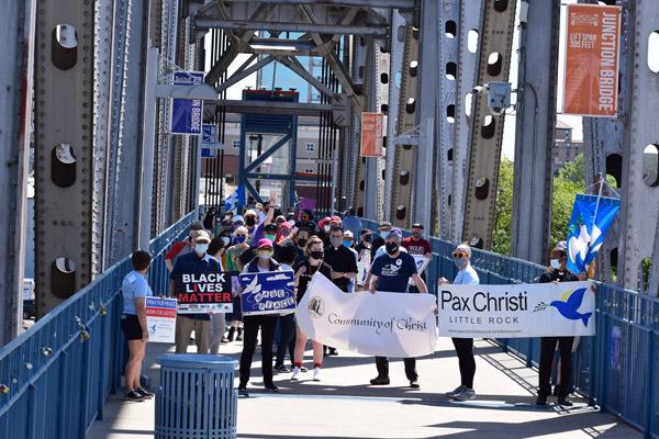 Attendees for the Pilgrimage for Peace walk across the Junction Bridge in Little Rock. More than 100 people attended April 11. (Courtesy Pax Christi Little Rock) 