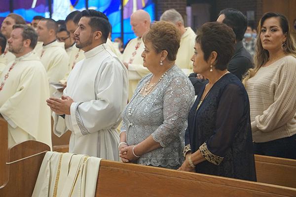 Jaime Nieto listens during his diaconate ordination Mass May 21, standing beside his mother Maria Del Carmen Nieto Bautista and his aunt Beatriz Nieto Bautista. (Aprille Hanson Spivey photo) 