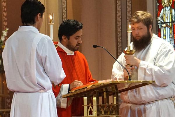 Deacon Jamie Nieto, ordained to the diaconate in May, reads the Gospel during the jubilee Mass June 29 at the Cathedral of St. Andrew in Little Rock. (Aprille Hanson Spivey photo) 