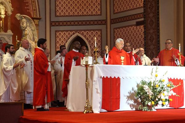 Bishop Taylor and fellow priests pray during the Liturgy of the Eucharist at the altar of the Cathedral of St. Andrew during the jubilee Mass June 29. (Aprille Hanson Spivey photo) 