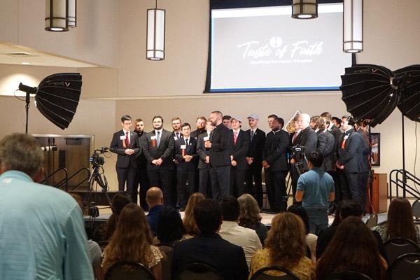 Diocesan seminarians join Bishop Anthony B. Taylor and Father Jeff Hebert on stage to close the Taste of Faith program singing “Salve Regina” Aug. 7. (Malea Hargett photo)