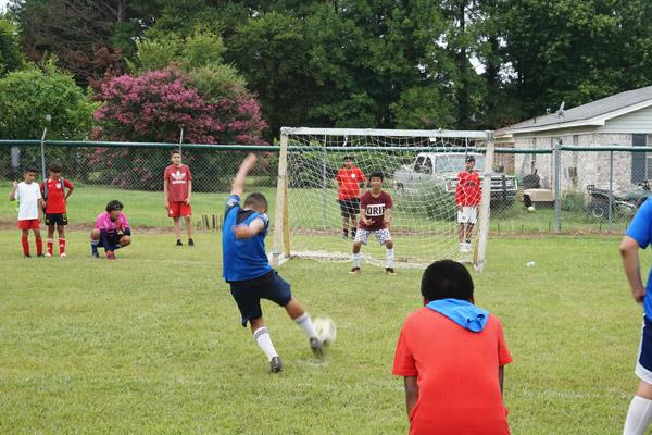 Youth from St. Andrew Church and the Danville community compete in a soccer tournament during the annual parish festival fundraiser at a city park Aug. 14. (Aprille Hanson Spivey photo)
