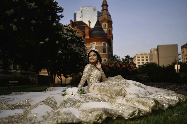 Ivela Garcia, a sophomore at Mount St. Mary Academy in Little Rock, poses in front of the Pulaski County Courthouse in downtown Little Rock before her quinceañera, a Mass and party to celebrate her transition from adolescence into young adulthood, held July 10 at St. Mary Church Church in North Little Rock. (Photo Yaz Jimenez/Jimenez Imagery)
