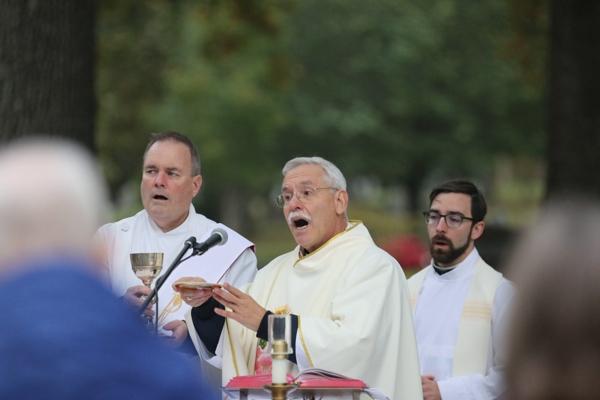 Bishop Anthony B. Taylor (center) celebrates the Liturgy of the Eucharist as Deacon Tim Costello and Father Joseph L. de Orbegozo look on at the All Souls Mass at Calvary Cemetery in Little Rock Nov. 2. (Photo Chris Price)