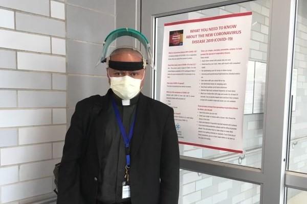 Fr. Beni Wego, SVD, wearing personal protective equipment (PPE) before visiting patients at the Emergency Room at Lake Charles Memorial Hospital in Louisiana in April 2020. Fr. Wego spent six years as a chaplain there before taking the same role at St. Bernards Medical Center in Jonesboro in September 2020. (Photo courtesy Fr. Beni Wego, SVD)