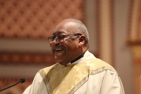 Father Warren Harvey, the bishop’s liaison for the Diocesan Council for Black Catholics, provides a brief history of the Knights of Peter Claver, which were formed after Blacks were not admitted to the Knights of Columbus, as he introduces Knight of Peter Claver Verdell Bunting Jr. at the 35th Annual Dr. Martin Luther King Jr. Memorial Mass at the Cathedral of St. Andrew Jan. 15. (Chris Price photo)