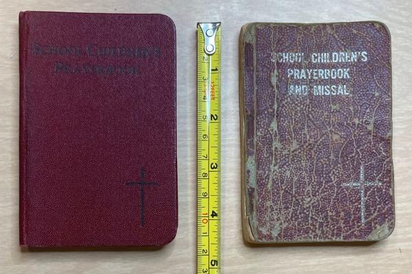 The tiny 3-by-4 ½ inch dark red book, which gained national attention, spreading across the country with several editions and about 100,000 copies, was absent from Subiaco Abbey’s archives until recently. (Father Elijah Owens photo)