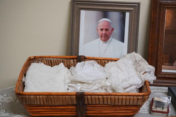 A portrait of Pope Francis with chapel veils available for women and girls to borrow for Mass. In the Diocese of Little Rock, Latin Mass is only allowed in the two personal parishes overseen by the Fraternity of St. Peter, St. John the Baptist in Cabot and Our Lady of Sorrows in Springdale.