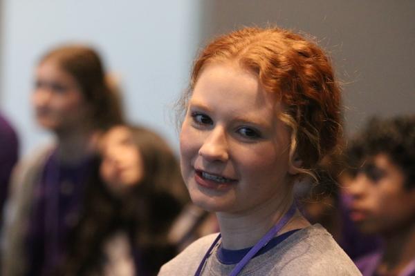 Bailey Brewer of St. Joseph Church in Conway and member of the Youth Advisory Council Leadership Team beams as she helps lead icebreakers to help attendees relax before Saturday’s session of the 70th Annual Catholic Youth Convention April 8 – 10.