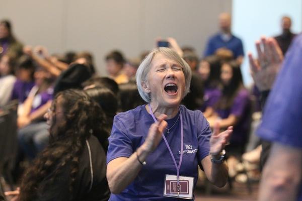 Liz Tingquist, the diocese’s director of youth ministry, enjoys a song keynote speaker Jackie Francois Angel played before delivering her presentation.
