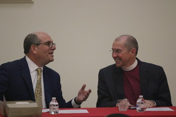 Rabbi Barry Block (left) of the Congregation B’nai Israel and Bishop Larry Benfield of the Episcopal Diocese of Arkansas have a laugh before the start of the Interfaith Prayer Breakfast, May 6, sponsored by and the Pulaski County Bar Association and the Saint Thomas More Society of Arkansas at McDonald Hall at the Cathedral of St. Andrew in Little Rock as part of the bar association’s Law Week 2022. (Chris Price photo)