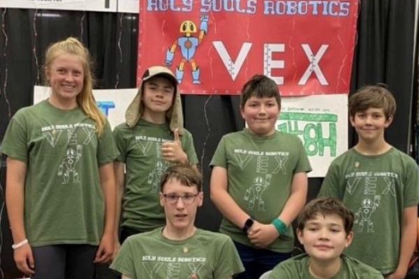 Holy Souls Robotics Team members (front row, left to right) George Saer, Curan Zachritz, (back row, left to right) Carson Vogelpohl, Harrison Brooks, Dean Doose and Peyton Baker man their workspace at the VEX Robotics World Championship in Dallas, May 3-5. The competition featured 688 teams from 49 states, three Native American nations and 27 countries. (Photo courtesy Holy Souls School)