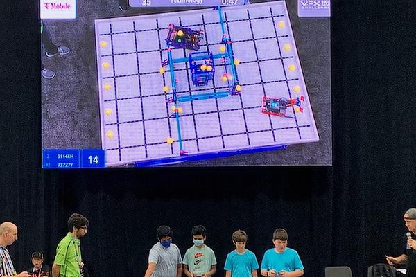 Holy Souls Robotics Team members (in blue t-shirts) Peyton Baker and Dean Doose compete at the  VEX Robotics World Championship in Dallas, May 3-5. The competition featured 688 teams from 49 states, three Native American nations and 27 countries. (Photo courtesy Holy Souls School)