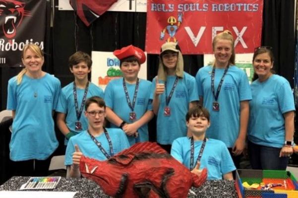 Holy Souls Robotics Team members and chaperones (front row, left to right) George Saer, Curan Zachritz, (back row, left to right) parent Amanda Brooks, Peyton Baker, Dean Doose, Harrison Brooks, Carson Vogelpohl and robotics team coach Jill Wingfield at the VEX Robotics World Championship in Dallas, May 3-5. The competition featured 688 teams from 49 states, three Native American nations and 27 countries. (Photo courtesy Holy Souls School)

