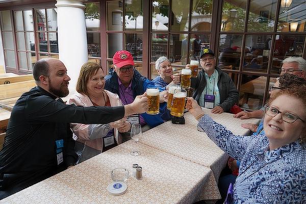 Prost! Pilgrims enjoy a round of beer after a long day on their feet.