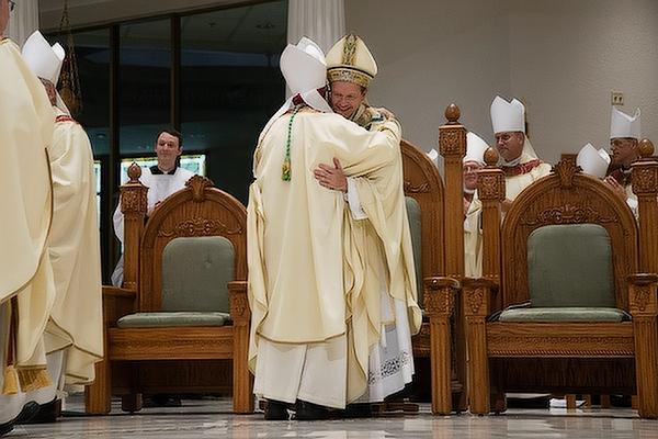 Bishop Anthony B. Taylor embraces Bishop Erik T. Pohlmeier immediately following his episcopal ordination, July 22. 