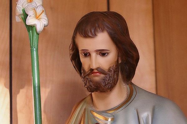 A statue of St. Joseph, a patron saint of Italians, stands at the entry to the sanctuary at St. Francis of Assisi Church in Little Italy. The parish celebrated its centennial Aug. 5-7. (Chris Price photo)