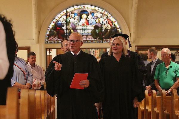 Sherwood District Judge Milas “Butch” Hale and Little Rock District Court Criminal Judge Melanie Martin lead the procession of judges and scholars into the 28th Annual Red Mass at the Cathedral of St. Andrew in Little Rock, Oct. 7. (Chris Price)
