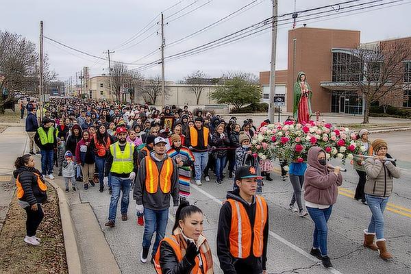 Members of St. Raphael Church in Springdale process three miles from the Jones Center to the church Sunday, Dec. 11 to celebrate the feast of Our Lady of Guadualupe. (Travis McAfee)
