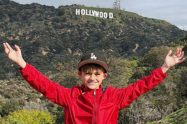 Jaydon Clark, 10, a fourth-grader at Immaculate Conception in North Little Rock, stands in front of the Hollywood sign in Los Angeles in early January. He will make his TV acting debut Feb. 28 as a guest star on ABC’s “The Rookie.” (Jeff Clark photo)