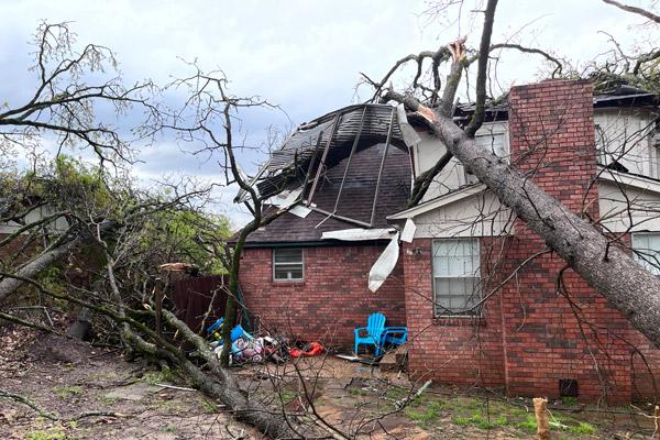 Angela Leatherwood huddled in a stairwell of this home with her eight children and their puppy during the March 31 tornado while her husband Nolan was stuck at work in Little Rock. The house, in the Walnut Valley neighborhood in Little Rock, was partially destroyed. (Courtesy Angela Leatherwood)

