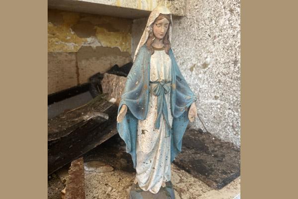 A muddy statue of the Virgin Mary sits on the kitchen counter in Susej Thompson’s Little Rock home after the house was destroyed in the March 31 tornado. She found it intact in the rubble and set it on the counter as a beacon of hope. (Courtesy Susej Thompson)