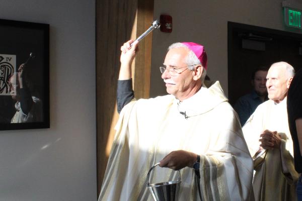 Bishop Taylor blesses the new CCM building during the dedication ceremony of the church's first Mass. Katie Zakrzewski.