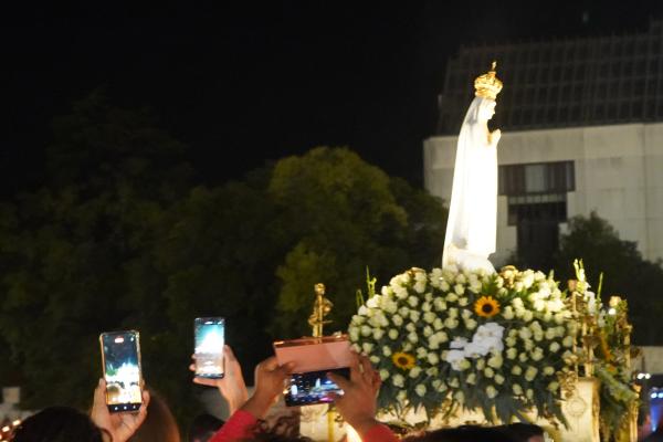 More than 180,000 pilgrims attend a candlelight rosary Oct. 12 at the Shrine of Our Lady of Fatima in Portugal. The rosary was prayed in Portuguese, Spanish, English and other languages.