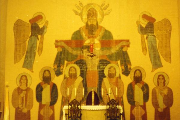 The mural behind the altar at St. Mary Church in Helena was damaged after being covered by heavy velvet curtains for over 30 years until parishioners restored it. © Eames Office, LLC. All rights reserved.