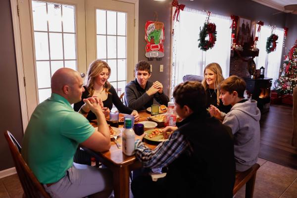Becky and Joey Dold, members of St. Elizabeth Church in Oppelo, make family dinners a priority. The couple has four children, Emma, 19, Mason, 17, Joseph, 15 and Landon, 13. The Dolds also have extended family members come over on Sundays twice a month for dinner. Bella Boos Photography.