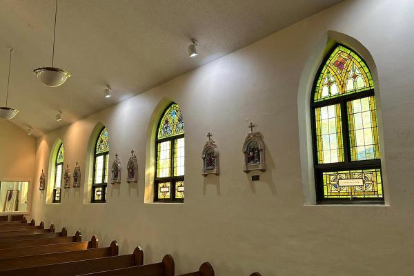 Courtesy St. Louis Church. Pastor Father Michael Johns worked alongside parishioners to replace the most damaged windows in the parish, with the help of Soos Stained Glass.