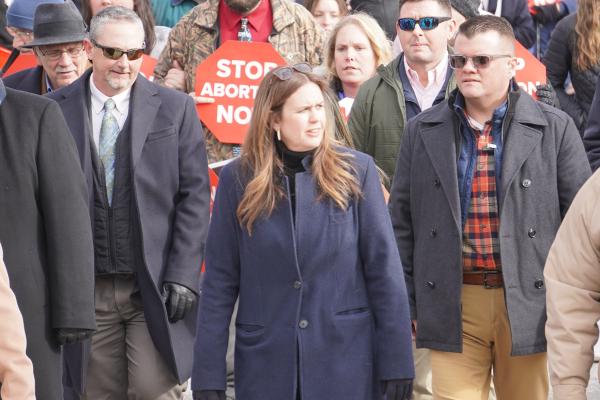 Gov. Sarah Huckabee Sanders marches in the March for Life Jan. 21 up to the State Capitol steps like previous Republican governors have done. 