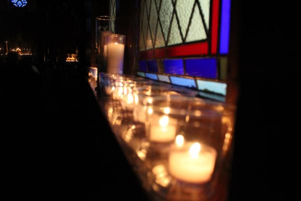 Lit candles line the window sill during Immaculate Heart of Mary Church's Tenebrae Lenten service in North Little Rock (Marche) March 27. (Katie Zakrzewski)