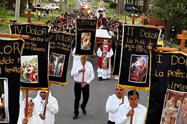 Parishioners at St. Barbara Church in De Queen march through the streets with banners during a Good Friday procession. (Courtesy Father Father Ramsés Mendieta)