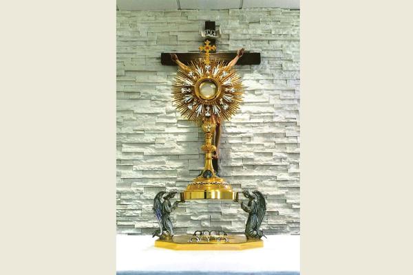 Honorable mention: A monstrance holding the Blessed Sacrament is offered for adoration at St. John the Baptist Church in Hot Springs, by Mary E. Stryjewski.